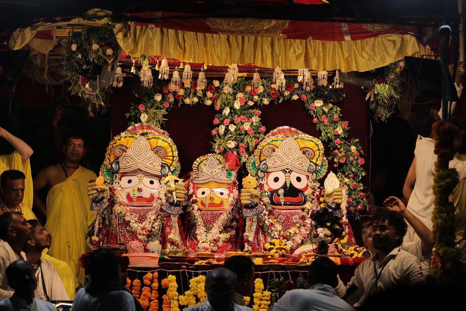 Colorful depiction of the Jagannath Rath Yatra festival with adorned deities and devotees.